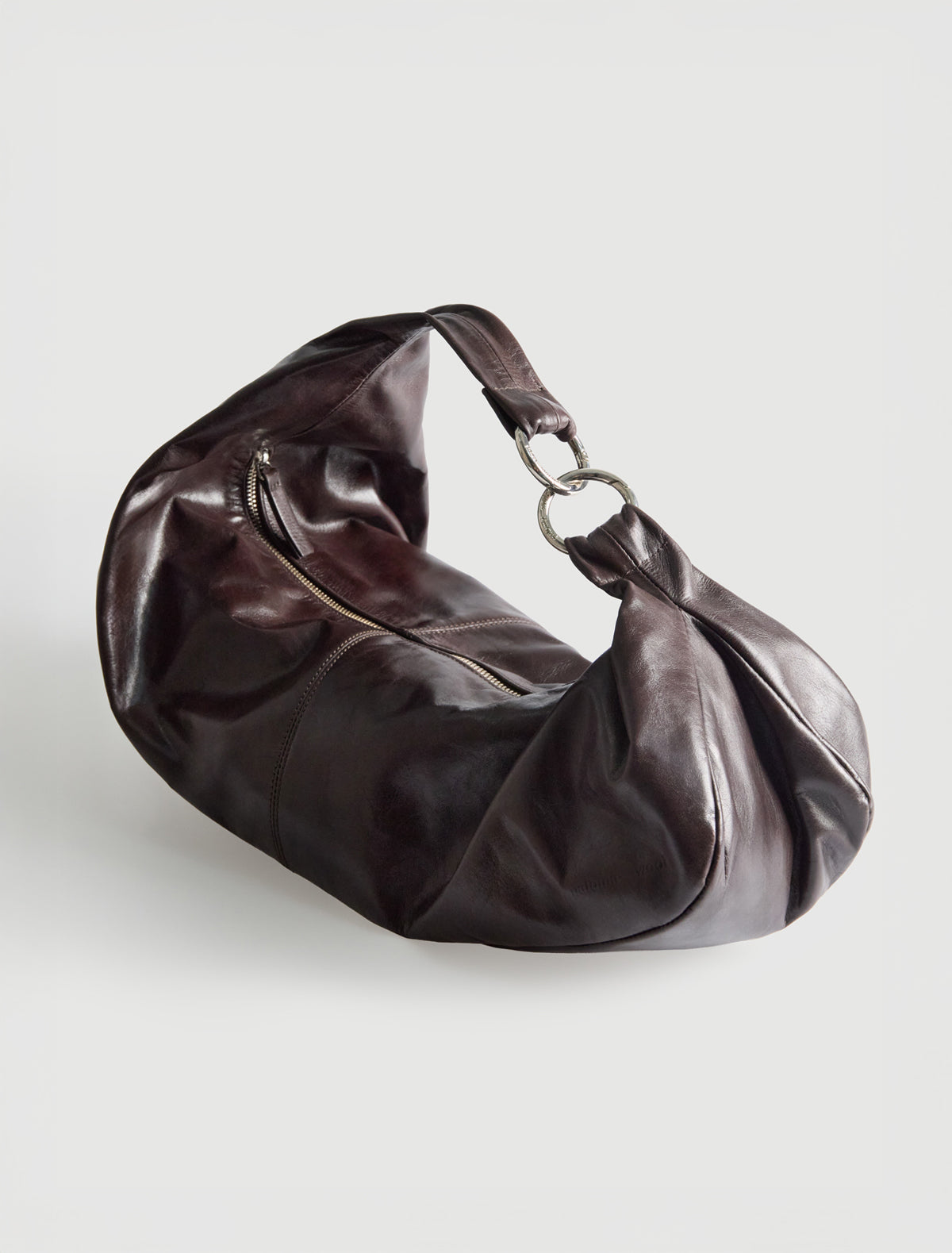 Dry elongated wrap around hobo style shoulder bag darkbrown