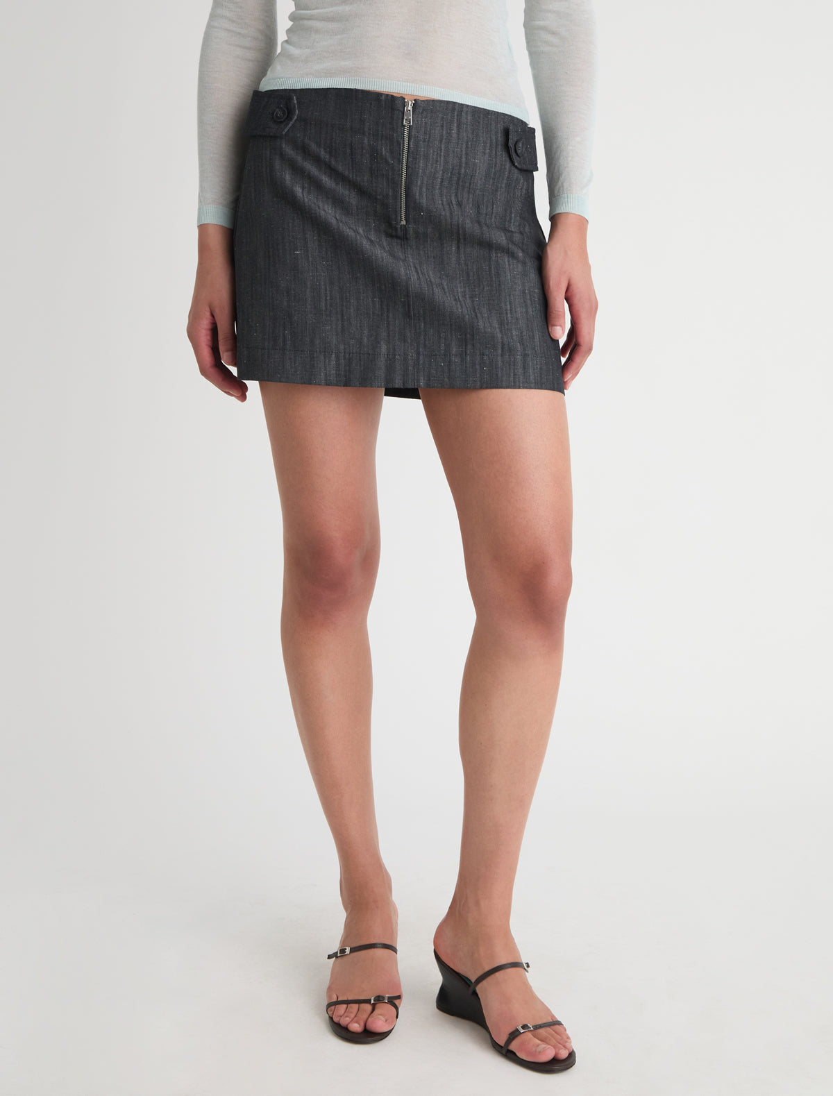 Deuna denim mini skirt side straps front zip closure