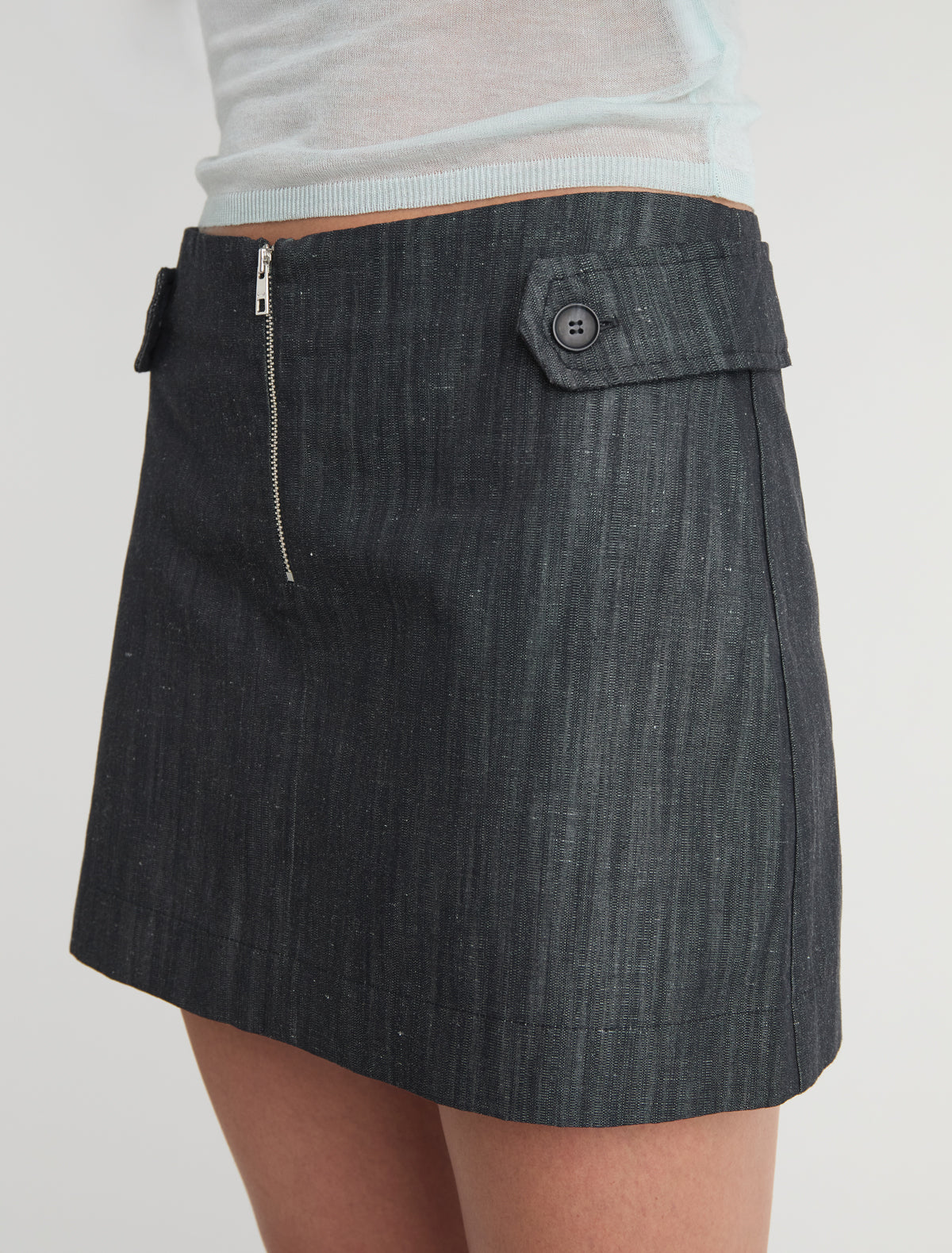 Deuna denim mini skirt side straps front zip closure