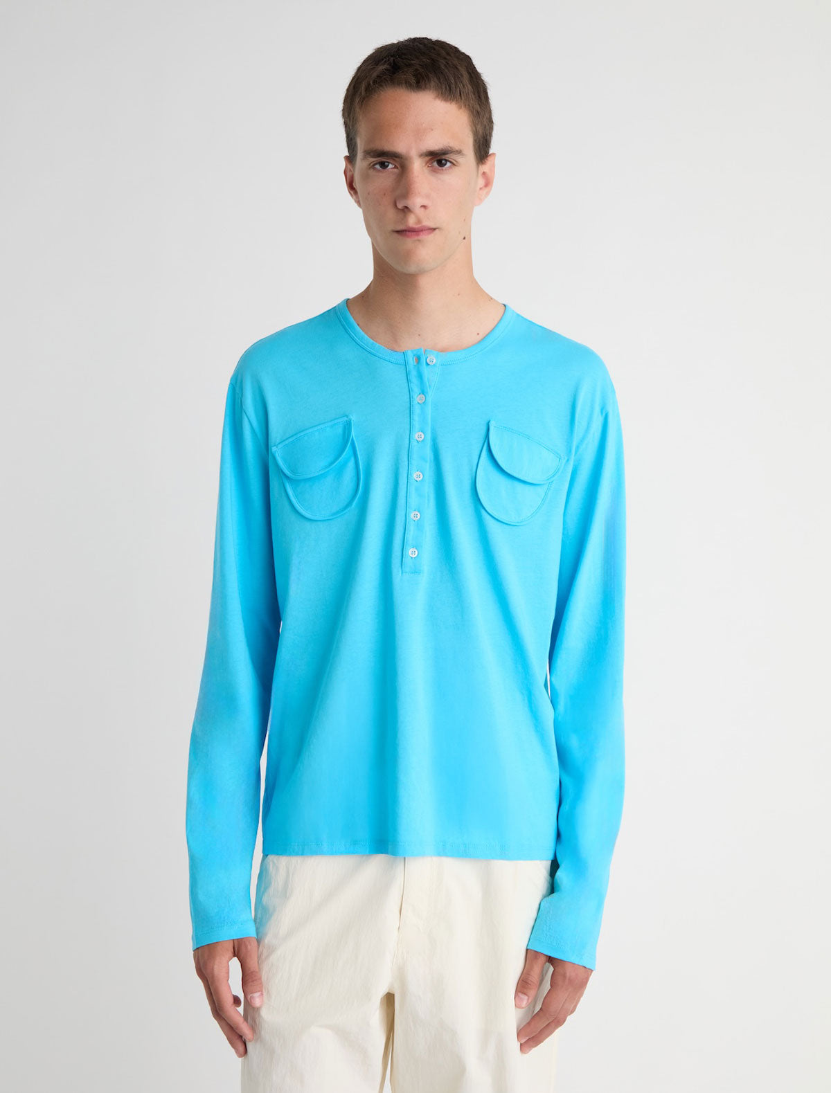 Nestor b long sleeve top crewneck chest pockets central button placket blue