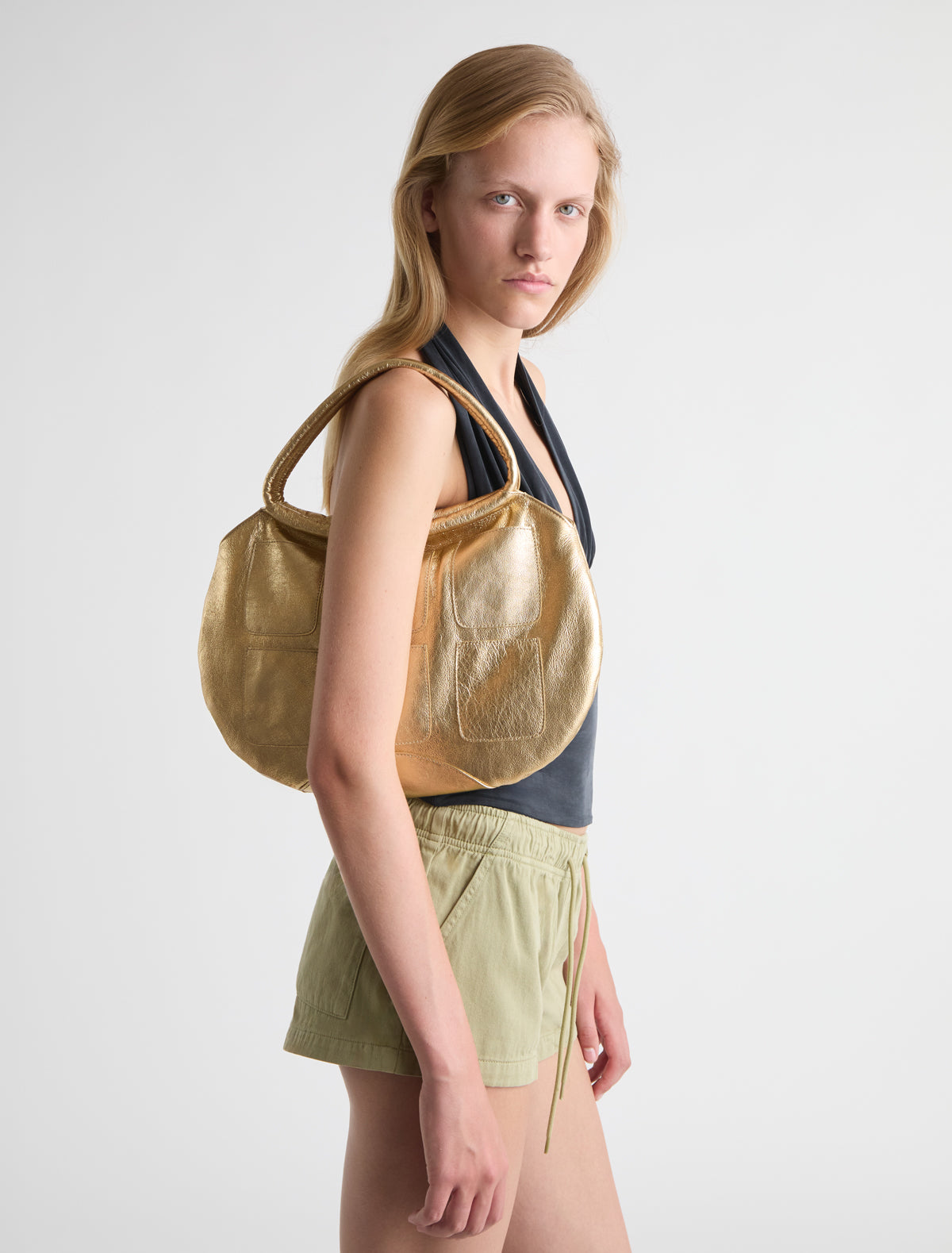 Pockets round shaped shoulder bag multiple pocket details gold