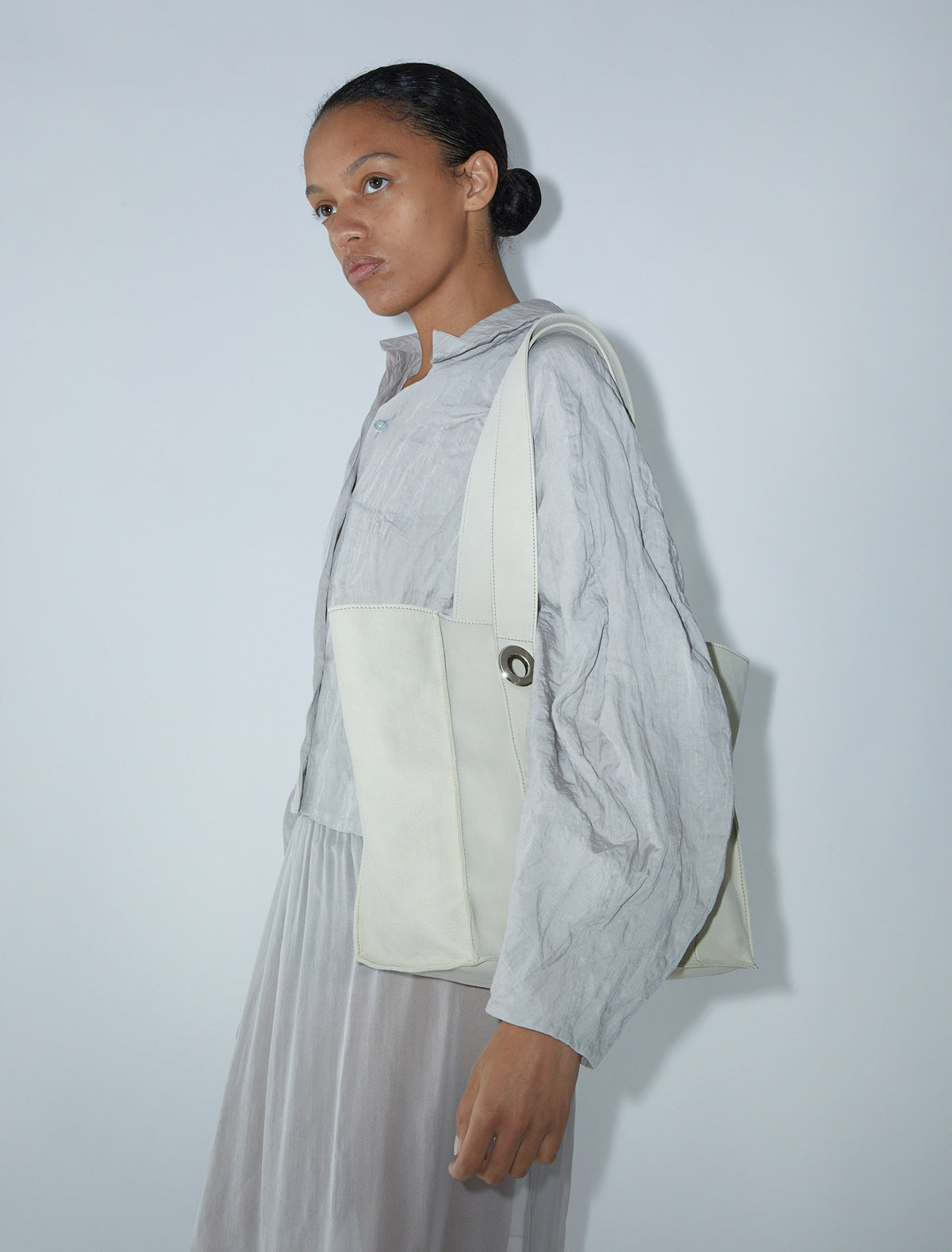 Milagros square shaped bucket bag eyelets detail ecru