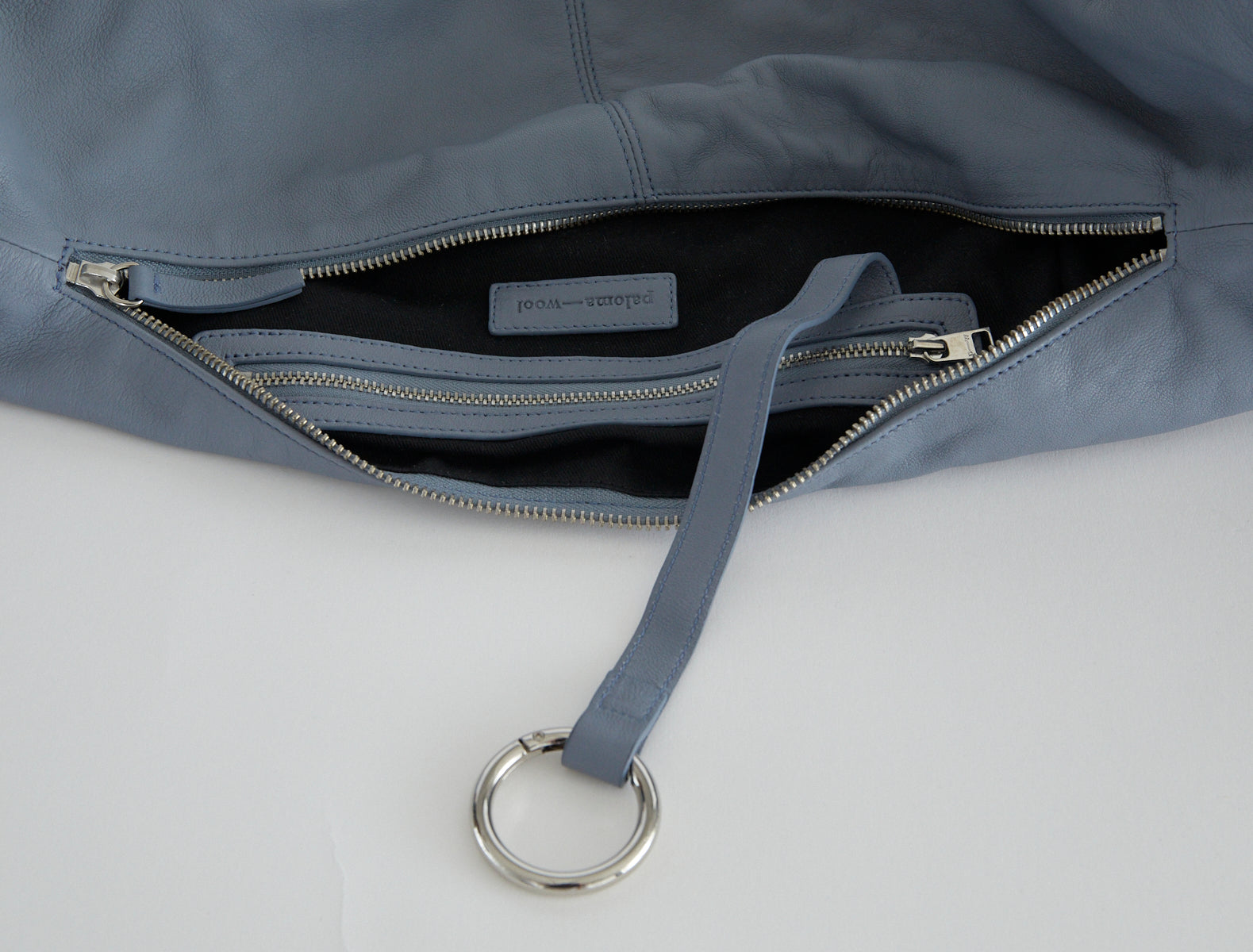 Dry elongated wrap around hobo style shoulder bag lightgreyishblue