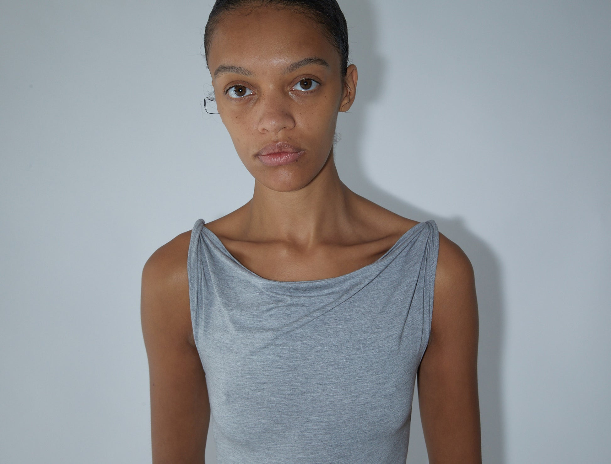 Simp sleeveless melange top twisted shoulder details grey